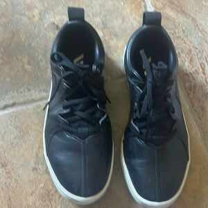 Black adidas children’s golf shoes